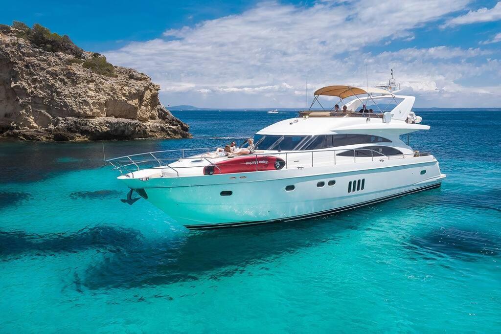a white boat in the water in the ocean at Euphoria Luxury Yacht including Full Day Charter for up to12 guests in Parkstone