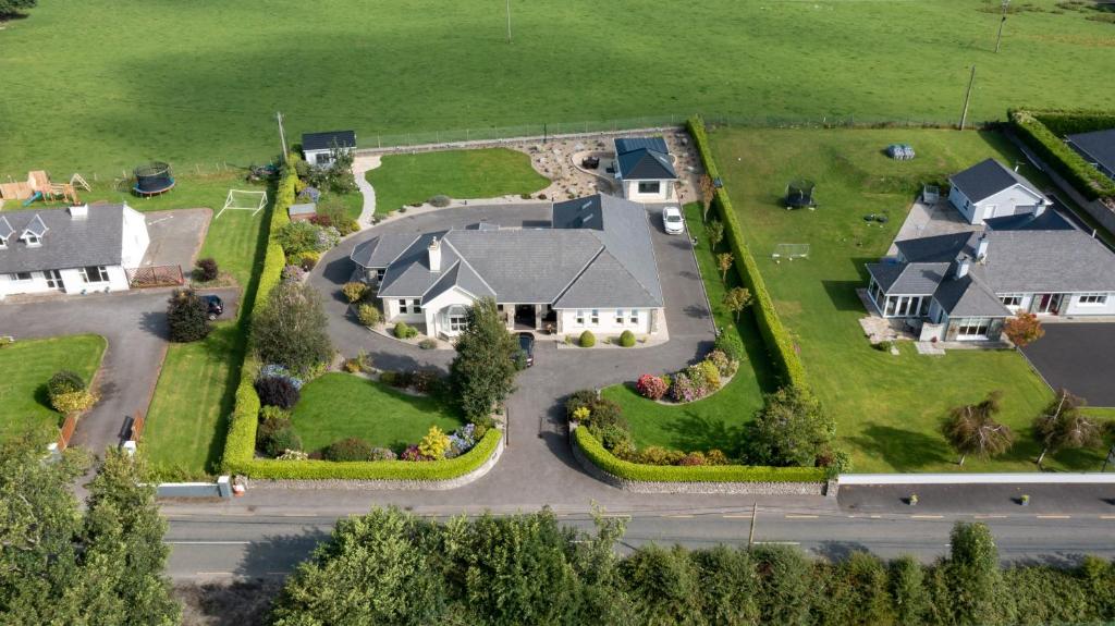 an aerial view of a house with a yard at Aghadoe Lodge in Killarney