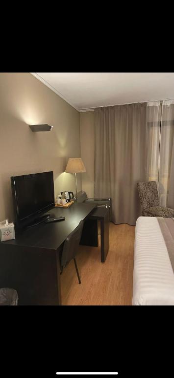 TV a/nebo společenská místnost v ubytování Park Hotel Airport
