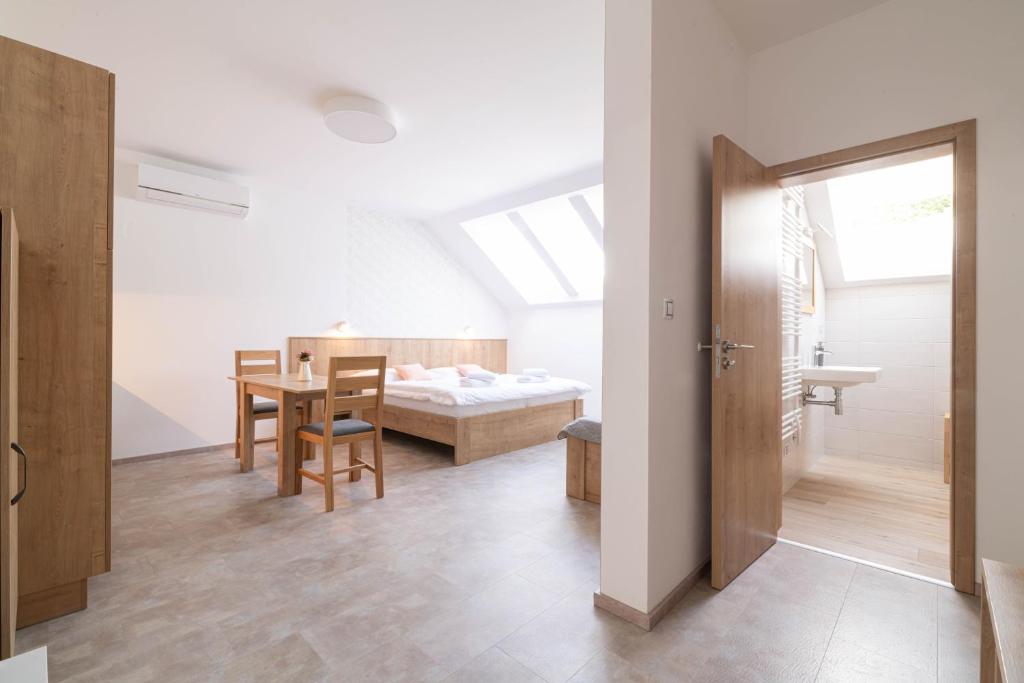 Postel nebo postele na pokoji v ubytování Apartmány Vinařství Šebesta