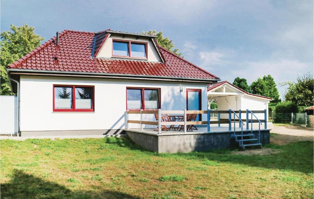 a small white house with a red roof at Beautiful Home In Rukieten With Wifi in Rukieten