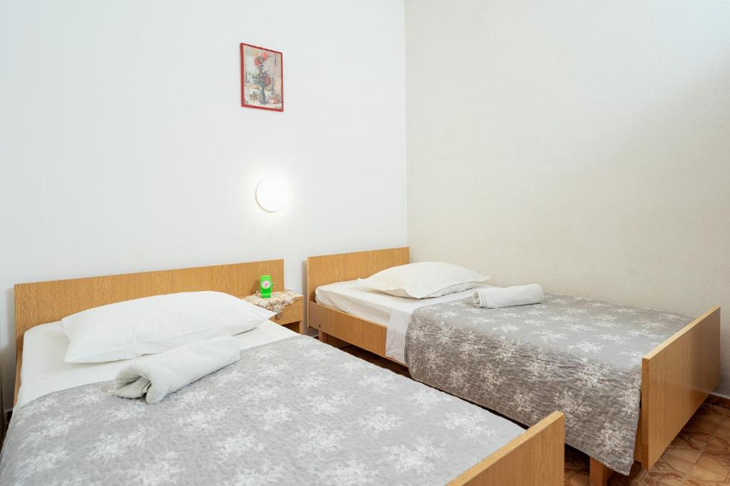 Postel nebo postele na pokoji v ubytování Holiday Home Sansevic