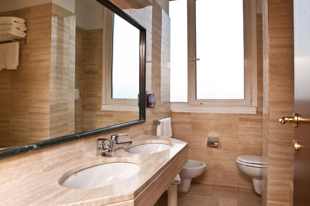 Koupelna v ubytování Hotel Alga