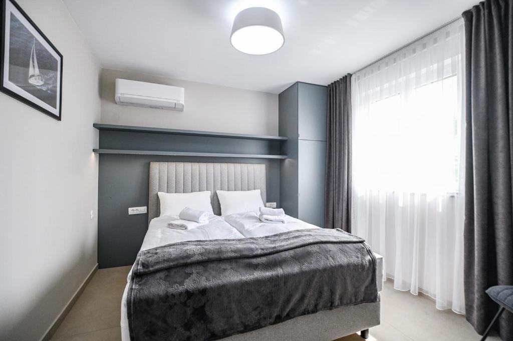Posteľ alebo postele v izbe v ubytovaní Luxury Apartment Nina with sea view