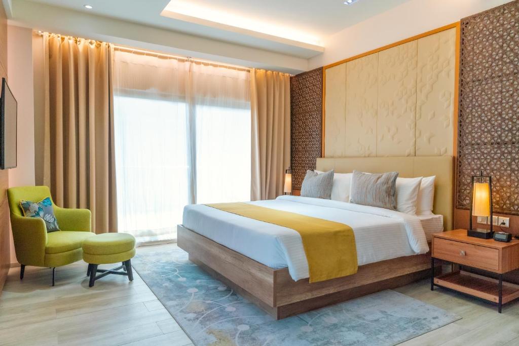 Postel nebo postele na pokoji v ubytování Nouveau Resort