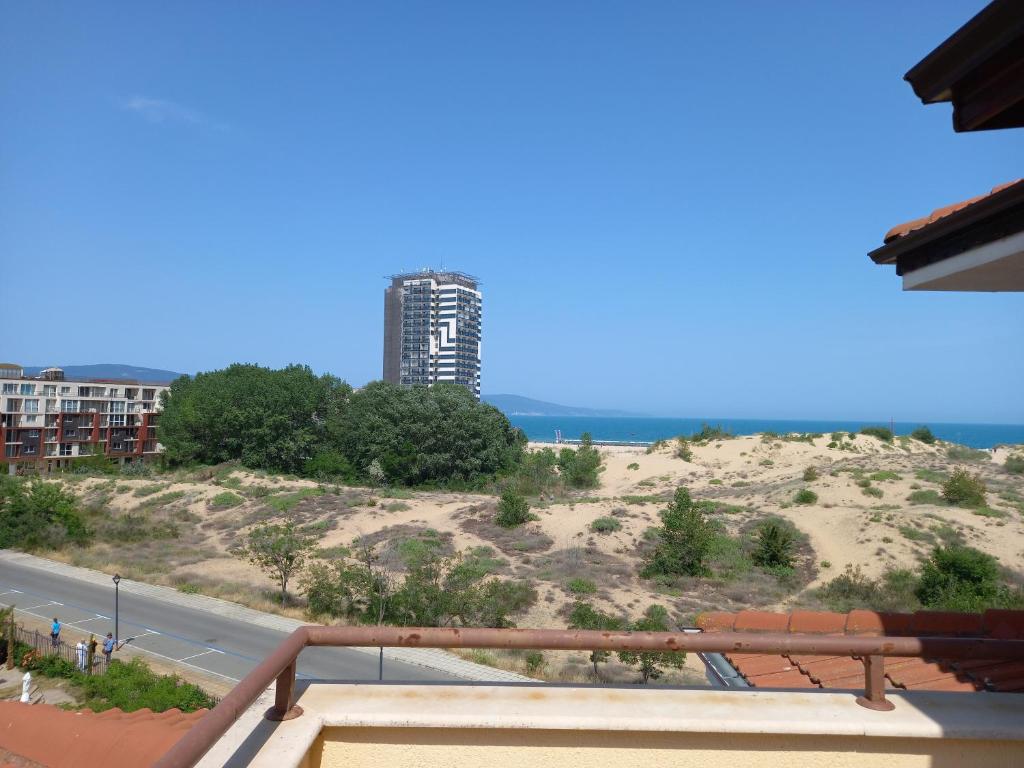 a view of the ocean from the balcony of a building at Студио в комплекс Golden Beach, Sunny Beach in Sunny Beach