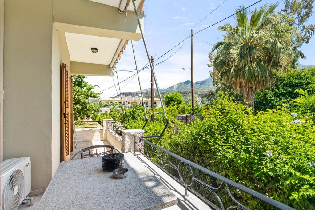 a balcony with a table and a view at Dimitra's Studios in Stoupa
