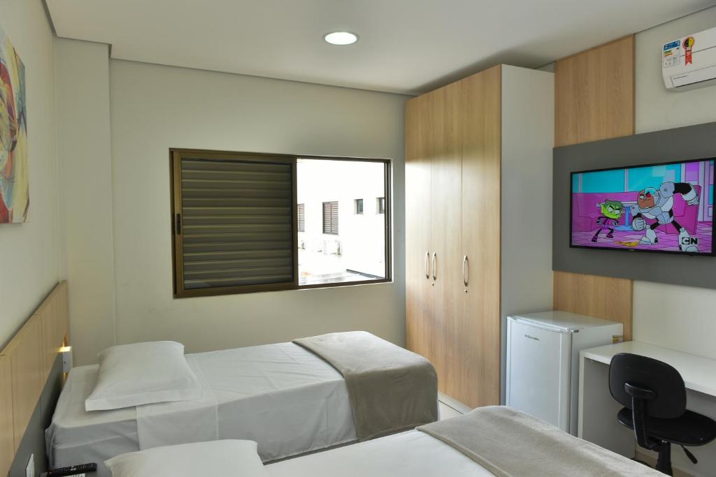 Postel nebo postele na pokoji v ubytování Hotel Plaza Garden