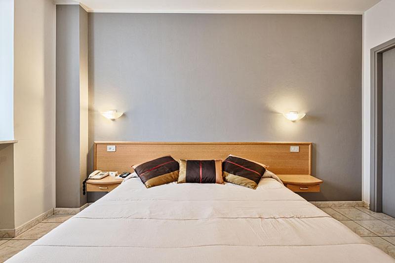 Posteľ alebo postele v izbe v ubytovaní Hotel Celestino