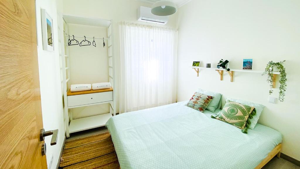 Postel nebo postele na pokoji v ubytování Marzia Boutique Home