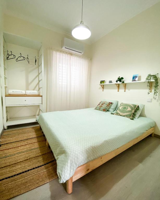 Postel nebo postele na pokoji v ubytování Marzia Boutique Home