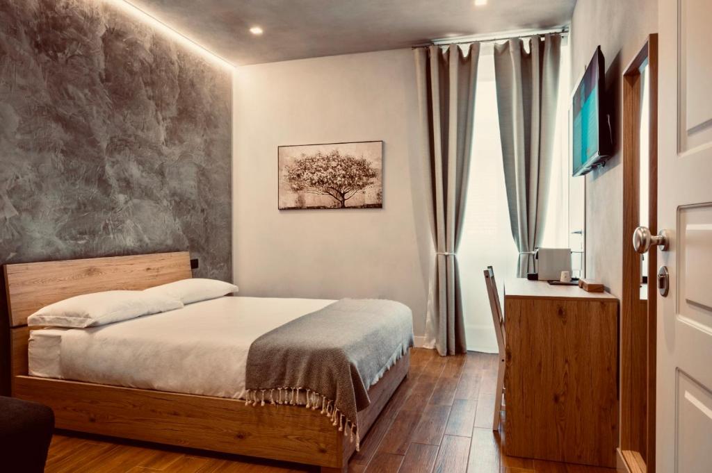 Postel nebo postele na pokoji v ubytování Rooms Don Alfonso