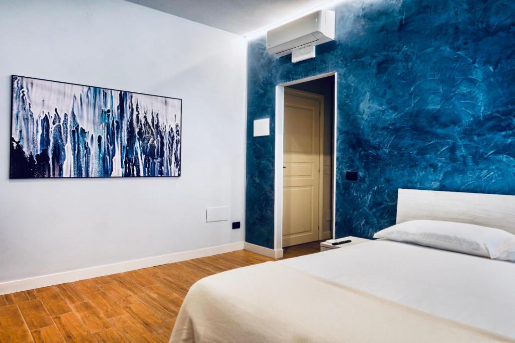 Postel nebo postele na pokoji v ubytování Rooms Don Alfonso