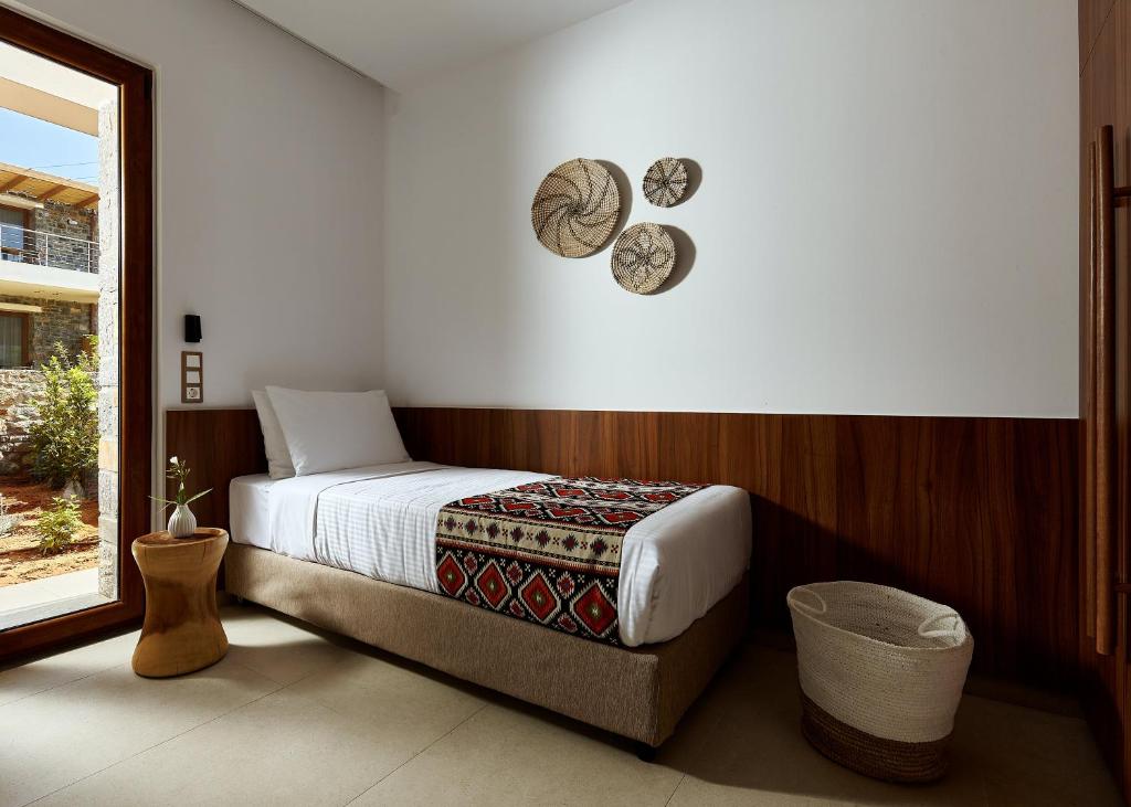 Postel nebo postele na pokoji v ubytování Volta Suites and Villas