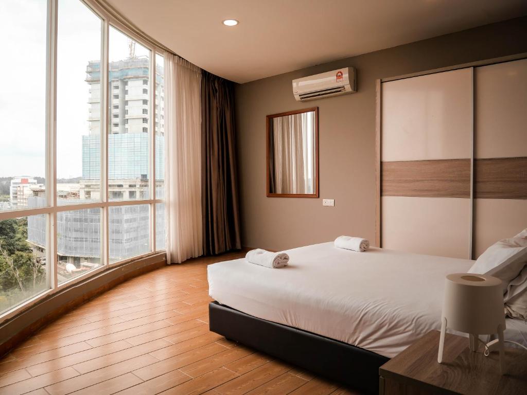 Postel nebo postele na pokoji v ubytování Bangi Perdana Hotel
