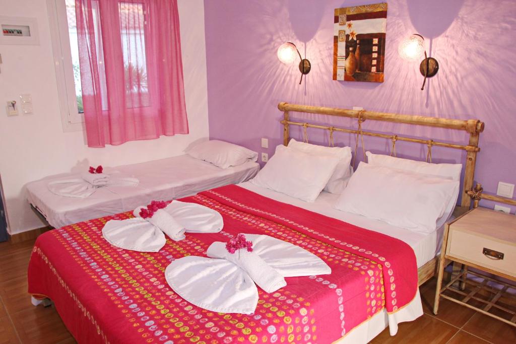 Postel nebo postele na pokoji v ubytování Coralli Rooms & Restaurant