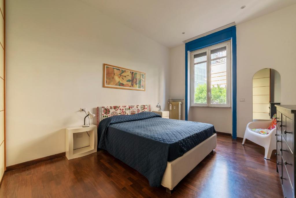 a bedroom with a bed and a window at Piazza Bologna Apartments in Rome