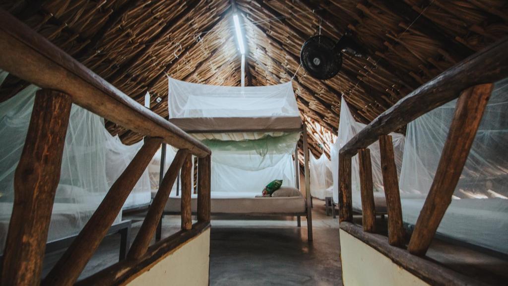 Postel nebo postele na pokoji v ubytování Makenke Hostel By Los Colores Ecoparque