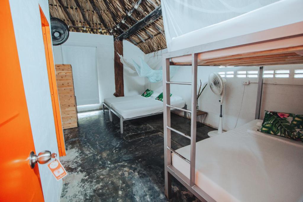 Postel nebo postele na pokoji v ubytování Makenke Hostel By Los Colores Ecoparque