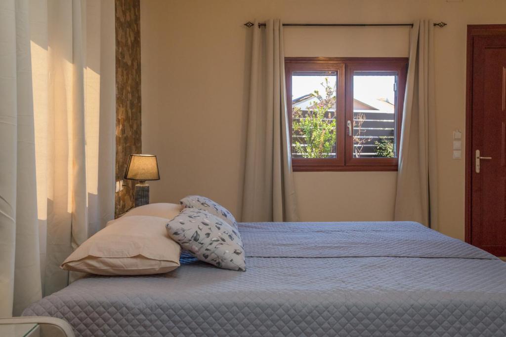 Postel nebo postele na pokoji v ubytování Villa Stathatos