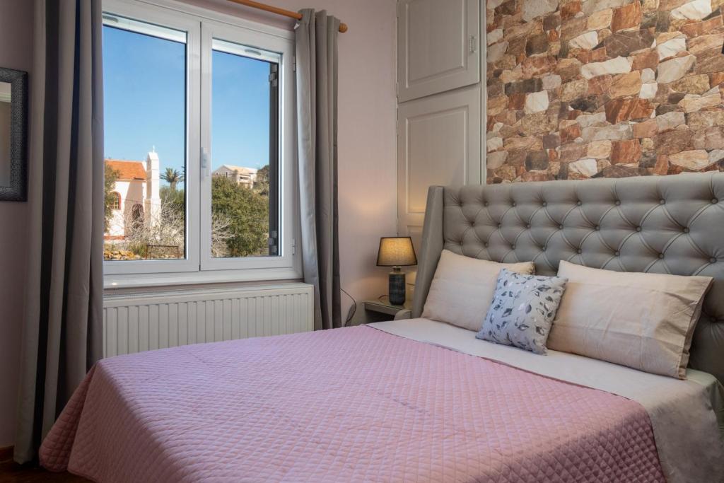 Postel nebo postele na pokoji v ubytování Villa Stathatos