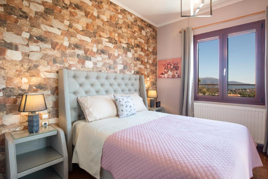 Postel nebo postele na pokoji v ubytování Villa Stathatos