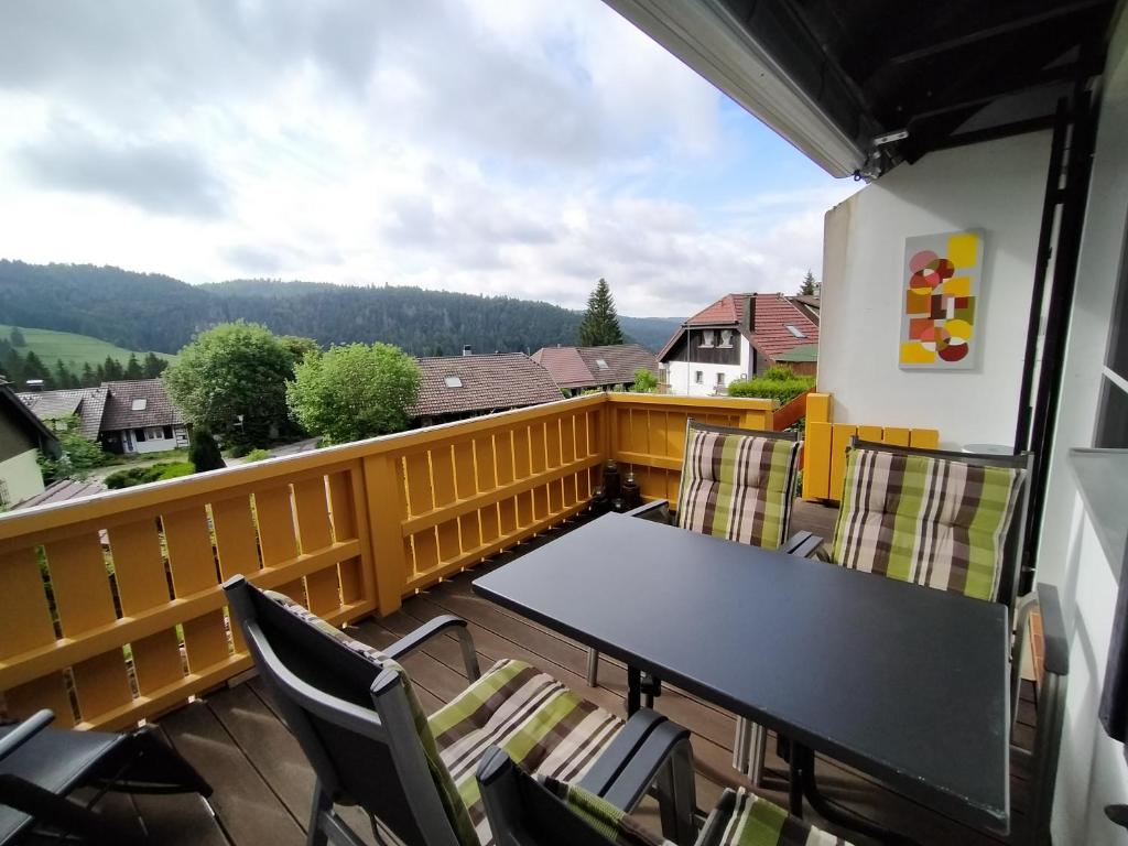 a balcony with a table and chairs and a view at Fichtenstüble in Todtmoos