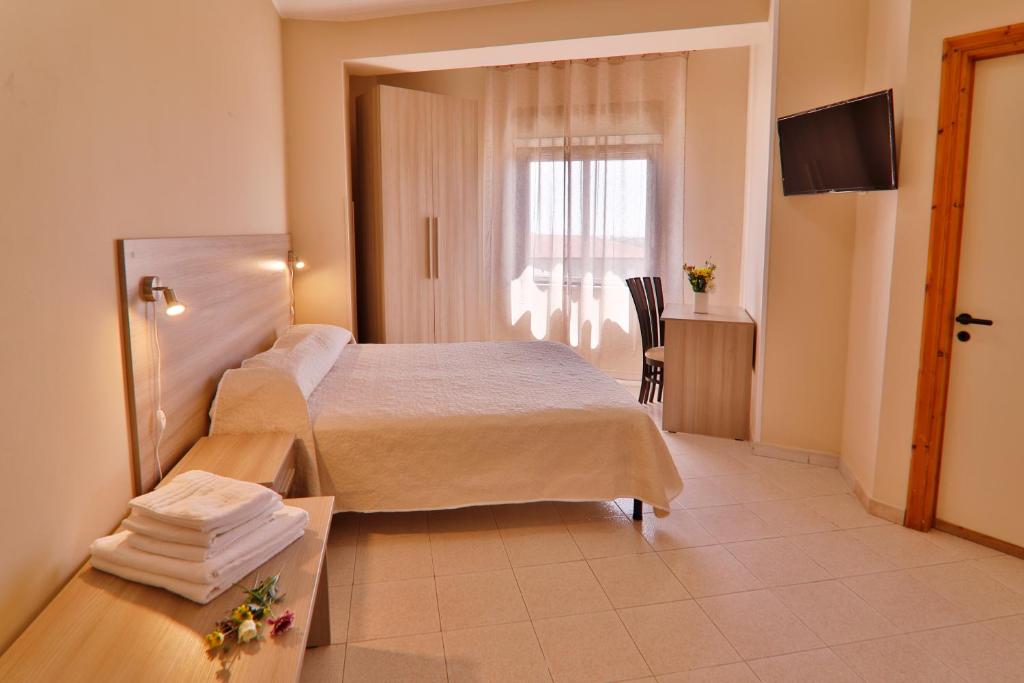 Postel nebo postele na pokoji v ubytování GHotel