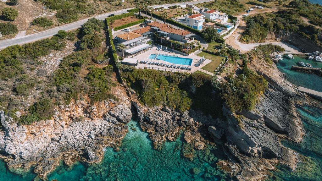 an aerial view of a house on a cliff at Blue Jasmine Hotel in Skala