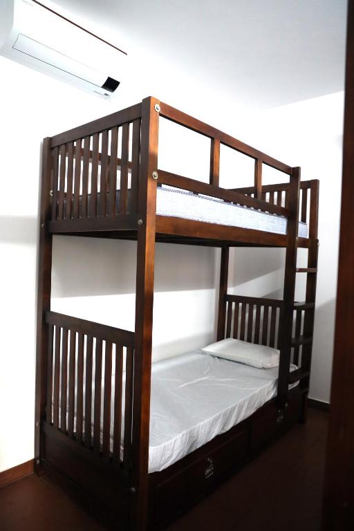 Postel nebo postele na pokoji v ubytování Back Packers Cochin Villa