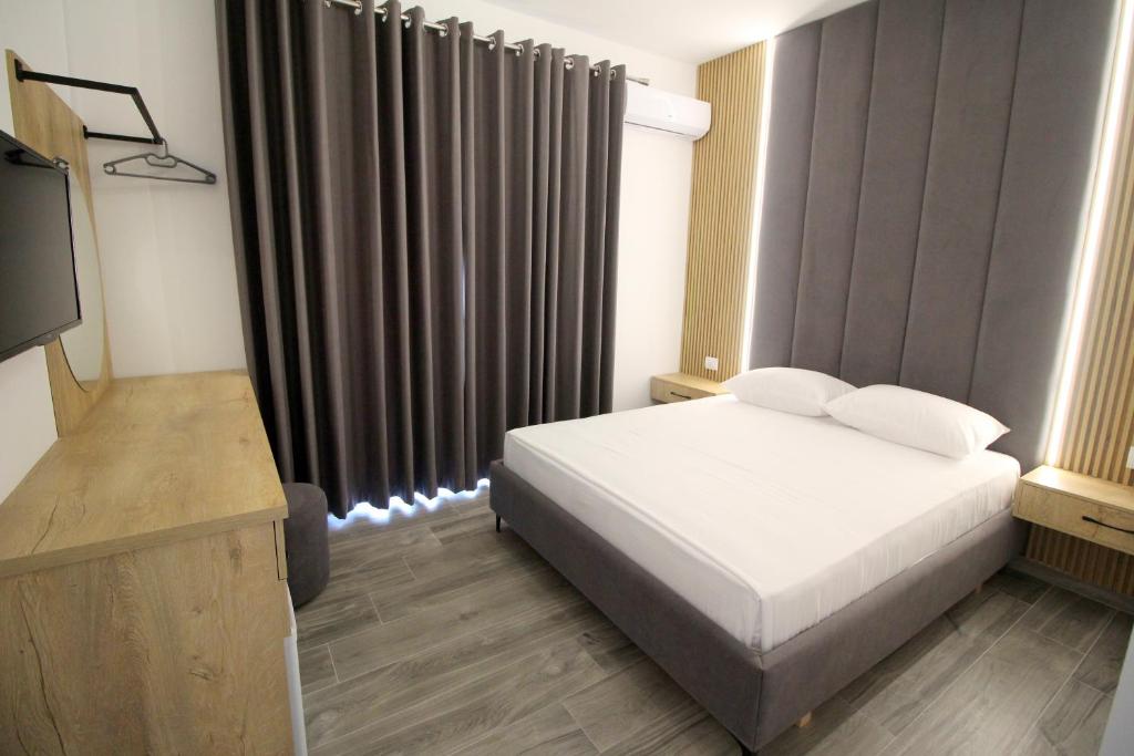 Postel nebo postele na pokoji v ubytování Hotel Villa Ambra