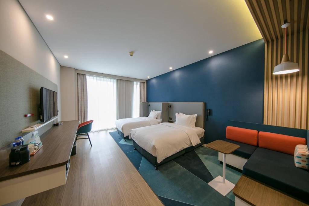 Postel nebo postele na pokoji v ubytování Holiday Inn Express Hefei High Tech by IHG
