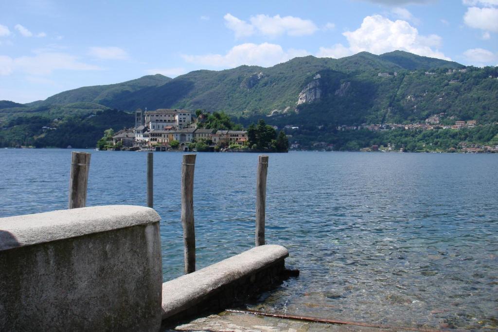 a view of a lake with mountains in the background at Apartments Cabianchi in Orta San Giulio
