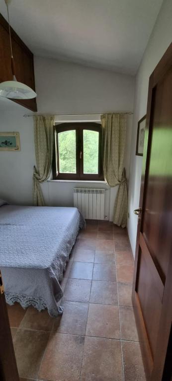 Posteľ alebo postele v izbe v ubytovaní Casavacanza al castello 2