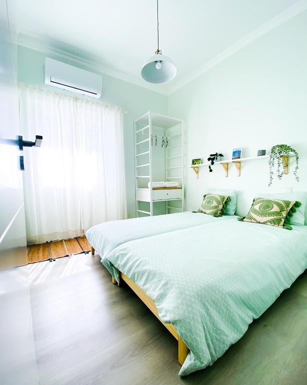 Postel nebo postele na pokoji v ubytování Marzia Boutique Home