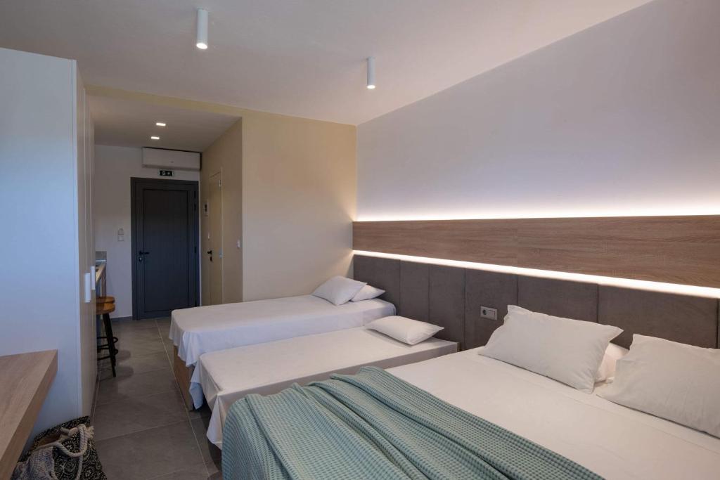 Un ou plusieurs lits dans un hébergement de l'établissement Asteras Hotel