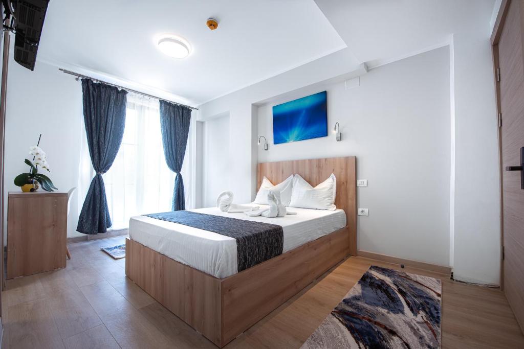a bedroom with a large bed in a room at Polu-X in Vama Veche