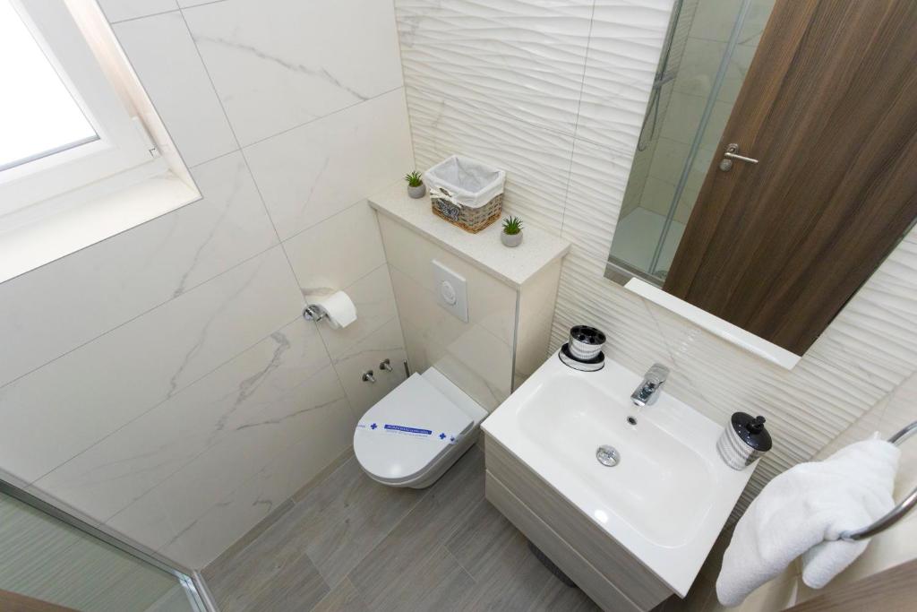 Koupelna v ubytování Apartments Vicin