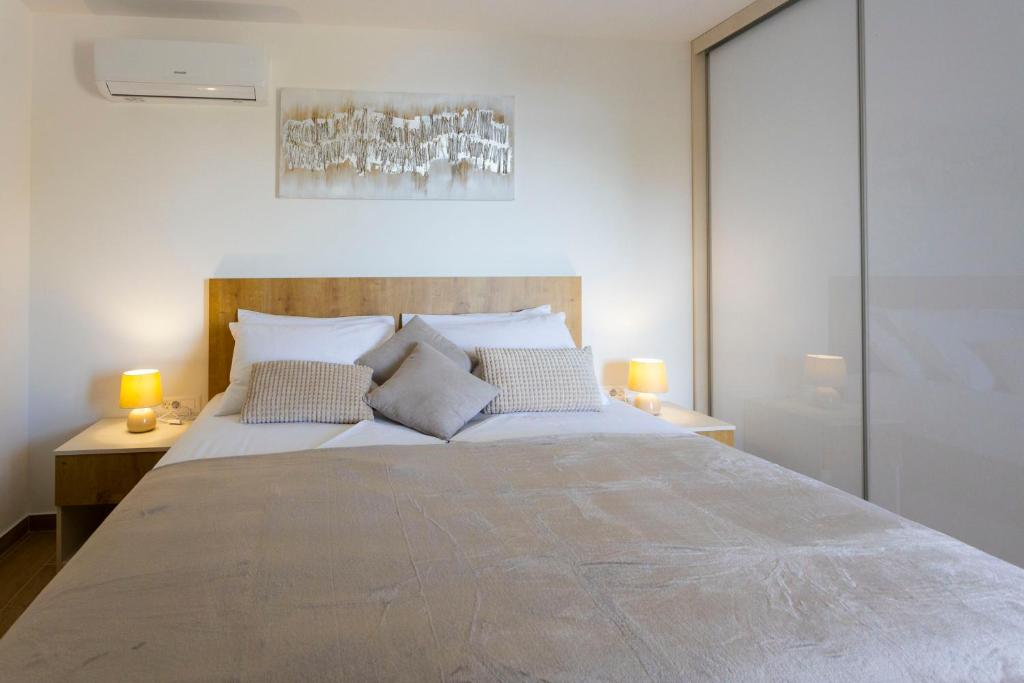 Postel nebo postele na pokoji v ubytování Apartments Vicin