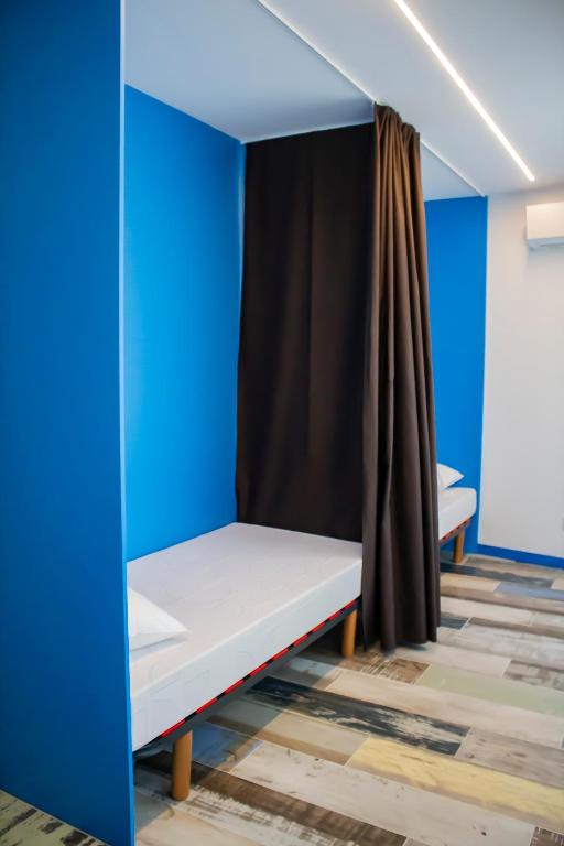 Posteľ alebo postele v izbe v ubytovaní Albergue playa de sabaris