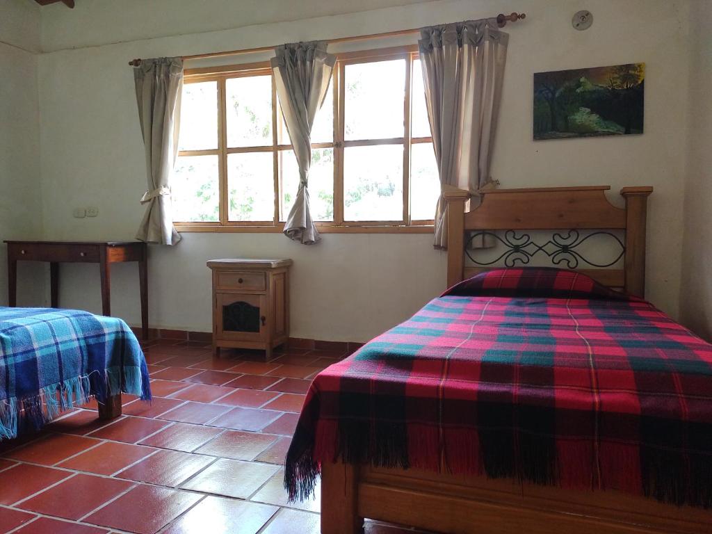 Llit o llits en una habitació de Hotel Ecoposada Viña de Aldana