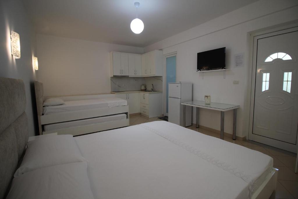 Postel nebo postele na pokoji v ubytování Hotel Villa Ambra