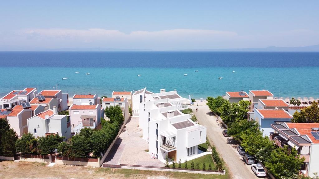 an aerial view of houses and the ocean at Villa Camelia by the sea in Polykhrono