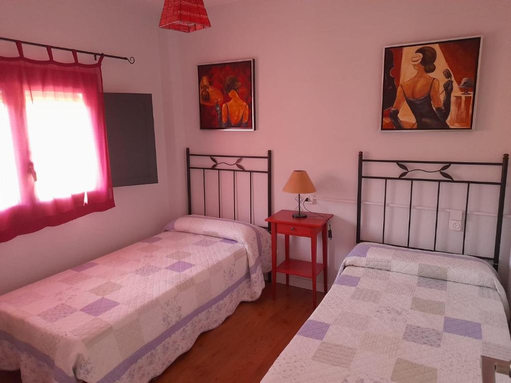 A bed or beds in a room at Casa Rural Prado Alto,Foz Calanda