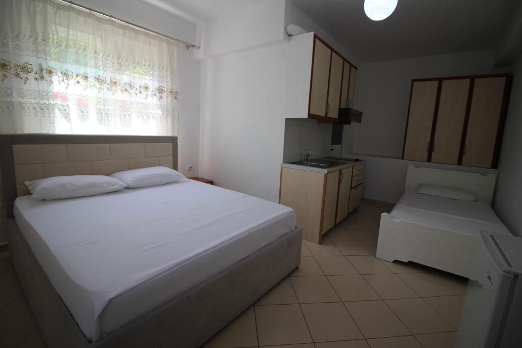 Postel nebo postele na pokoji v ubytování Hotel Villa Ambra