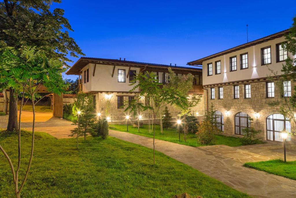 an exterior view of a building at night at Arbanashki Han Hotelcomplex in Arbanasi