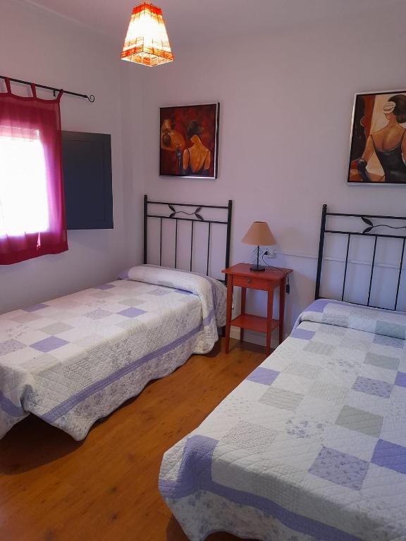 A bed or beds in a room at Casa Rural Prado Alto,Foz Calanda