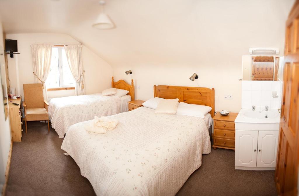 Postel nebo postele na pokoji v ubytování Tower Lodge B&B