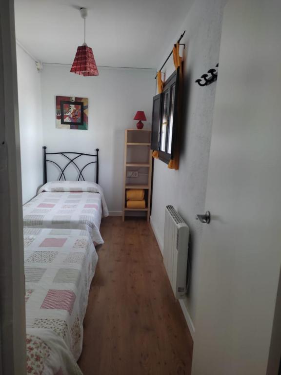A bed or beds in a room at Casa Rural Prado Alto,Foz Calanda