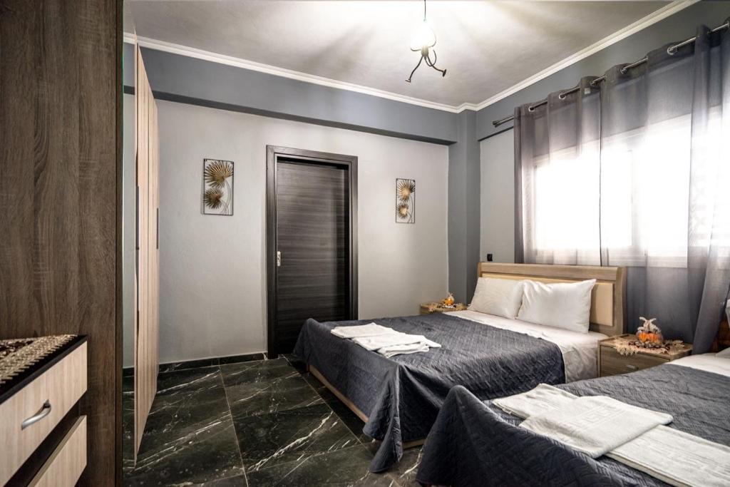 Postel nebo postele na pokoji v ubytování Zois' House